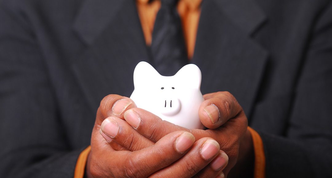 Man holding piggy bank